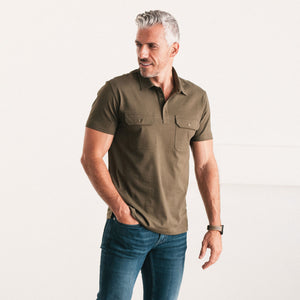 Batch Men's Constructor Short Sleeve Polo Shirt – Olive Green Cotton Jersey Image Standing on Body