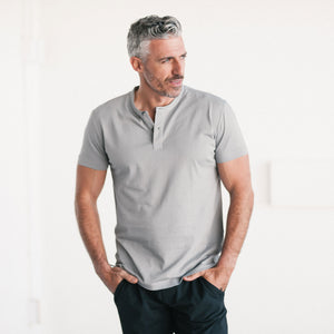 Batch Men's Essential Short Sleeve Henley Shirt – Cement Gray Cotton Jersey Image Standing on Body