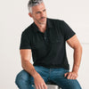 Batch Men's Constructor Short Sleeve Polo Shirt – Black Cotton Jersey Image On Body Sitting