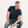 Batch Men's Constructor Short Sleeve Polo Shirt – Navy Cotton Jersey Image On Body Sitting