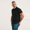 Batch Men's Essential Short Sleeve Polo Shirt – Black Cotton Jersey Image On Body Standing