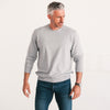 Batch Men's Essential Sweatshirt – Granite Gray Melange French Terry Image On Body Standing and Looking